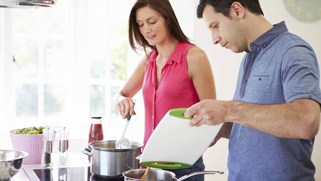 cooktops couple cooking dinner