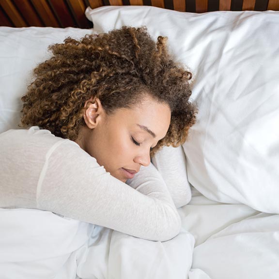 woman sleeping on fresh pillows sq